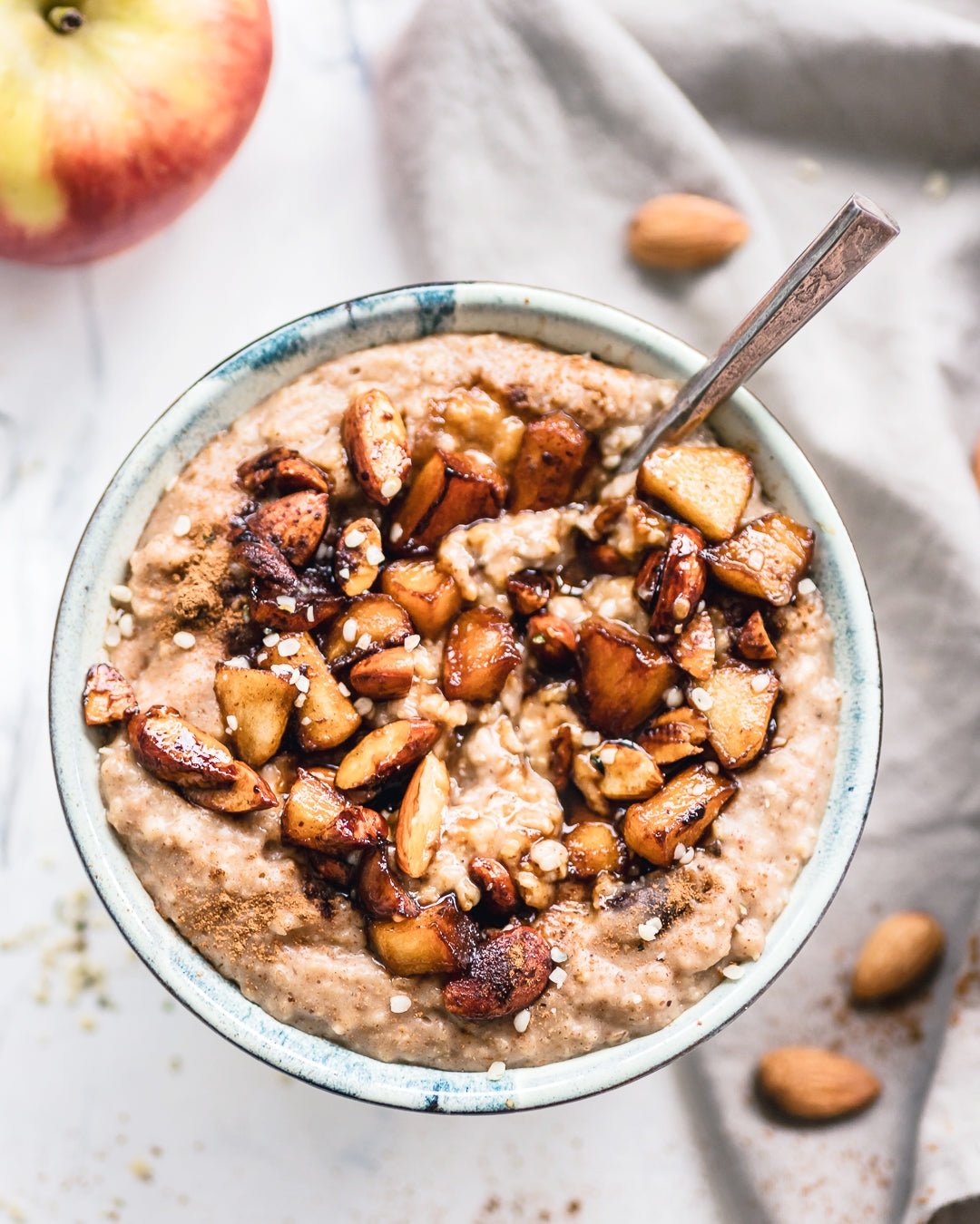 Date Cinnamon Oatmeal Topped With Caramelized Apples And Almonds